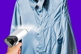 Close up shot of the Loheer clothes steamer used to de-wrinkle a button-up shirt 