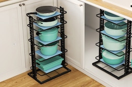 pots and pans organizer on floor and in cabinet