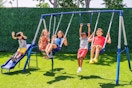 Lifestyle image of kids swinging on the Sportspower Swing Set outside