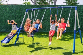 Lifestyle image of kids swinging on the Sportspower Swing Set outside