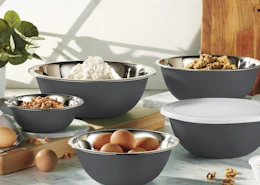 grey mixing bowls on a counter with baking ingrdients inside