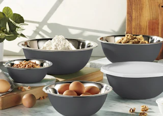 grey mixing bowls on a counter with baking ingrdients inside