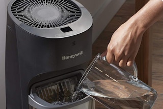 someone filling up the honeywell humidifer