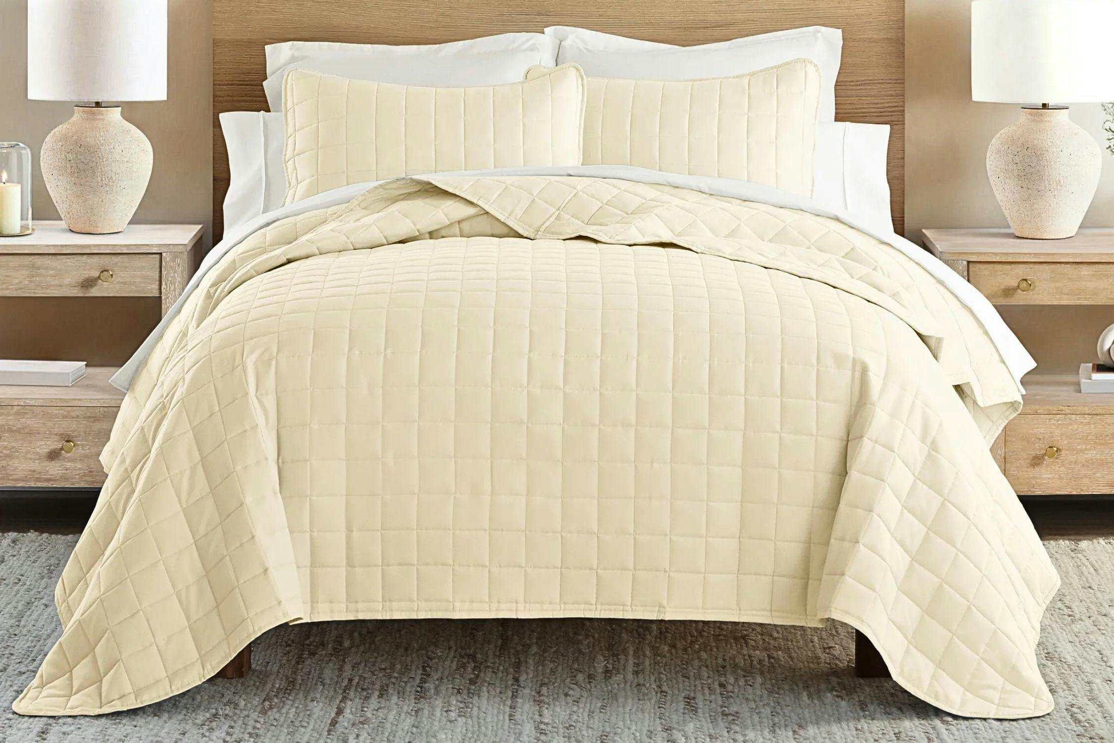 Lifestyle image of a quilted comforter set in yellow (lifestyle image)