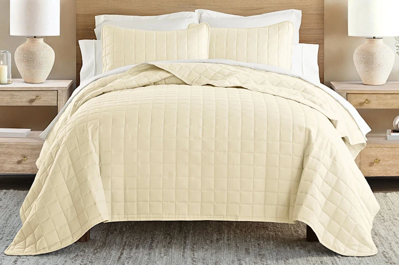 Lifestyle image of a quilted comforter set in yellow (lifestyle image)