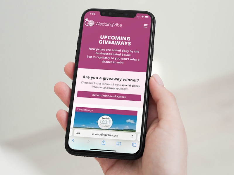 a person looking at the wedding vibe website on their iphone