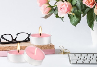tea lights on table with roses