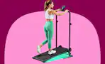 Woman using a walking pad at an incline