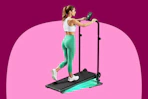 Woman using a walking pad at an incline