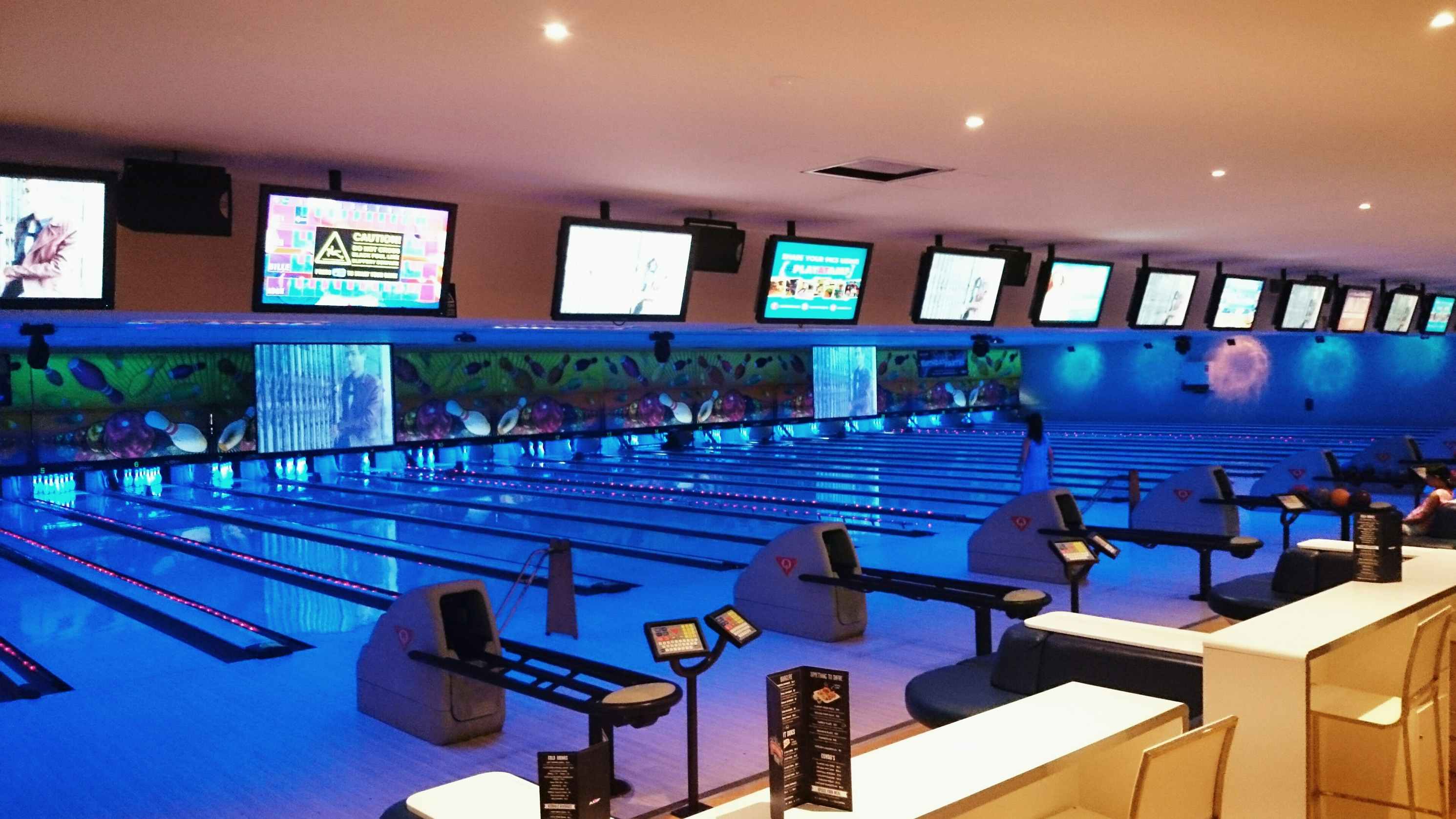 Bowling alley lanes with blue lighting