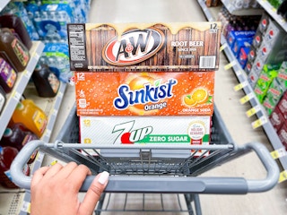 7up, a&w, and sunkist soda 12 packs in a walgreens cart