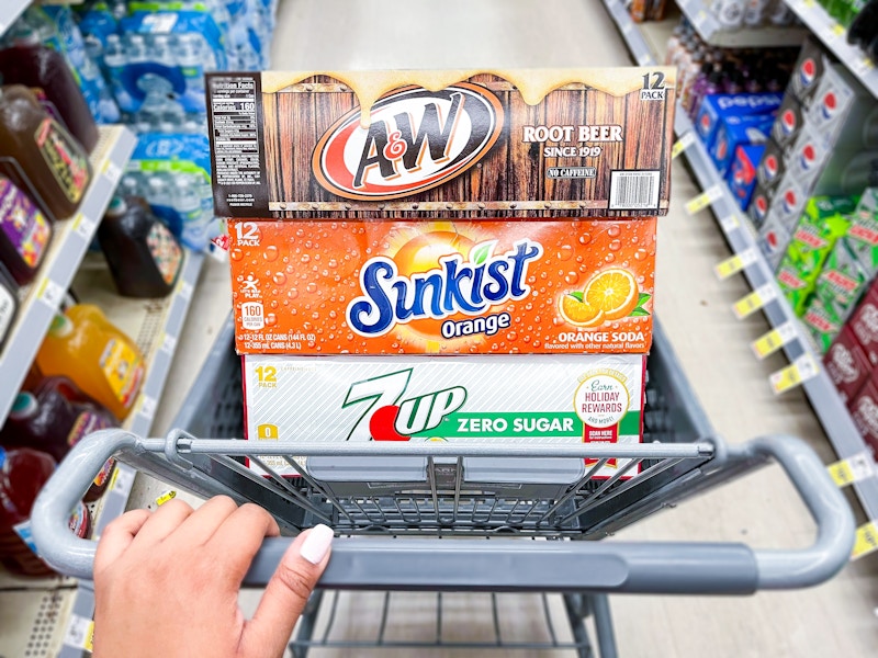 7up, a&w, and sunkist soda 12 packs in a walgreens cart