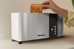 Mueller UltraToast Full Stainless Steel Toaster 2 Slice with toast in it.