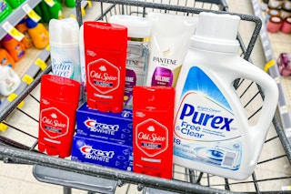 shopping cart filled with Purex detergent, Old Spice deodorant, Crest toothpaste, Pantene shampoo, and Gillette shave gel
