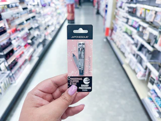 hand holding a japonesque nail clipper in walgreens