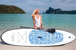 a woman near a stand up paddleboard