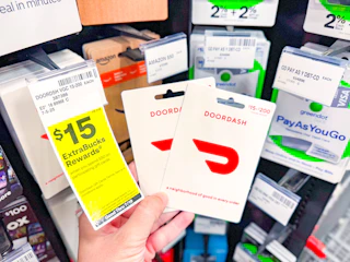 hand holding gift cards in cvs