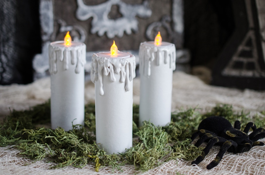 three toilet paper tubes with fake candles on top