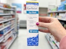 hand holding a bausch + lomb eye wash at target