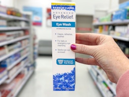 hand holding a bausch + lomb eye wash at target
