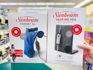 hand holding heating pad box