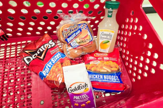 doritos, ball park buns, goldfish crackers, tyson chicken nuggets, and simply lemonade in a cart