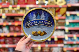 hand holding tin of cookies