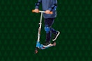 child riding on a kick scooter