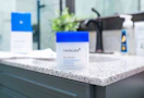a container of Medicube toner pads on a sink's counter