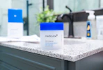 a container of Medicube toner pads on a sink's counter