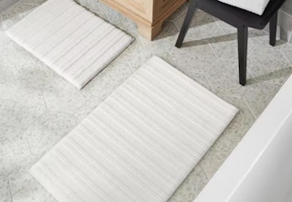 white 2-piece bath rug set in a bathroom