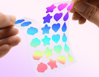colorful pimple patches on a sheet being seperated