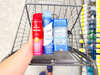hand holding old spice, secret, gillette deodorants in walgreens