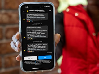Someone holding up their phone showing the KCL Hottest Deals broadcast channel