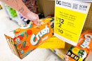 hand pickup up a crush soda 12-pack