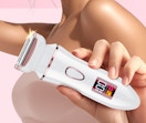 a person holding a bikini trimmer