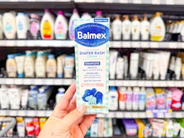 hand holding a package of Balmex diaper rash cream