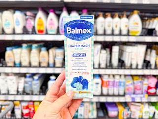 hand holding a package of Balmex diaper rash cream