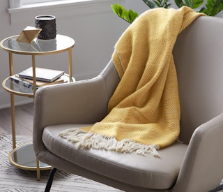 modrn wool blanket staged in living room