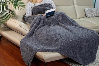 a woman with a throw blanket