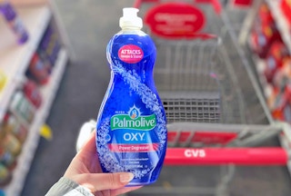 hand holding bottle of Palmolive dish soap