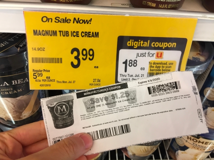 Paper coupon for Magnum ice cream held up by a Magnum sales tag