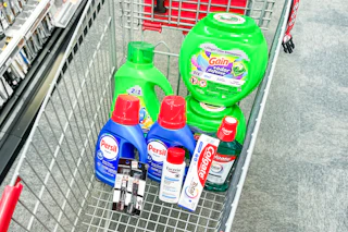 gain and persil detergent, covergirl makeup, eucerin lotion, and colgate oral care in a cart