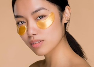 a women wearing gold under eye patches