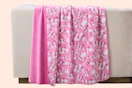Paris Hilton Butterflies Reversible Throw Blanket over the back of furniture