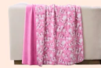 Paris Hilton Butterflies Reversible Throw Blanket over the back of furniture