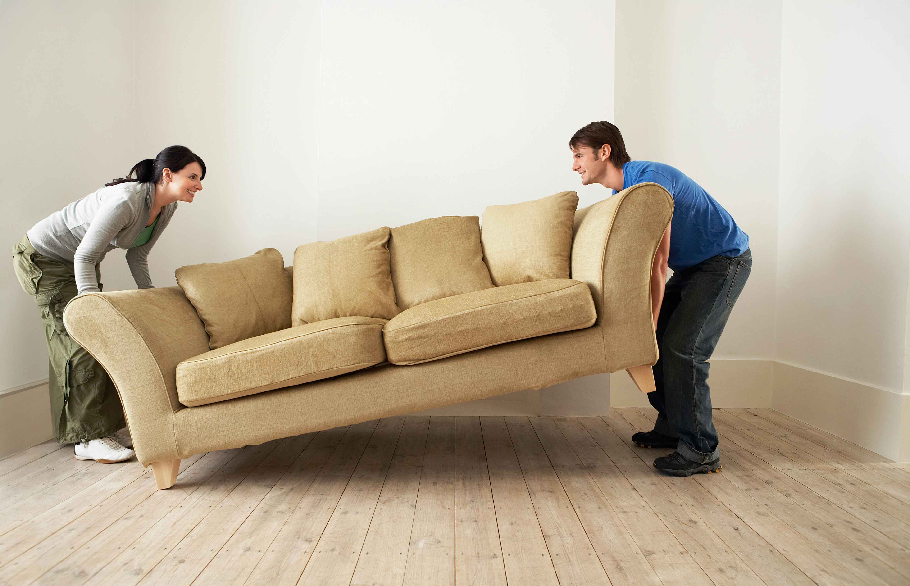 Young Couple moving a couch