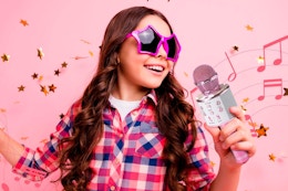 kid singing with the Claire's Karaoke Microphone