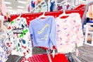 toddler sweatshirts in hello kitty, spiderman, and california designs hanging off the side of a target cart