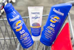 three coppertone sunscreens in a shopping cart